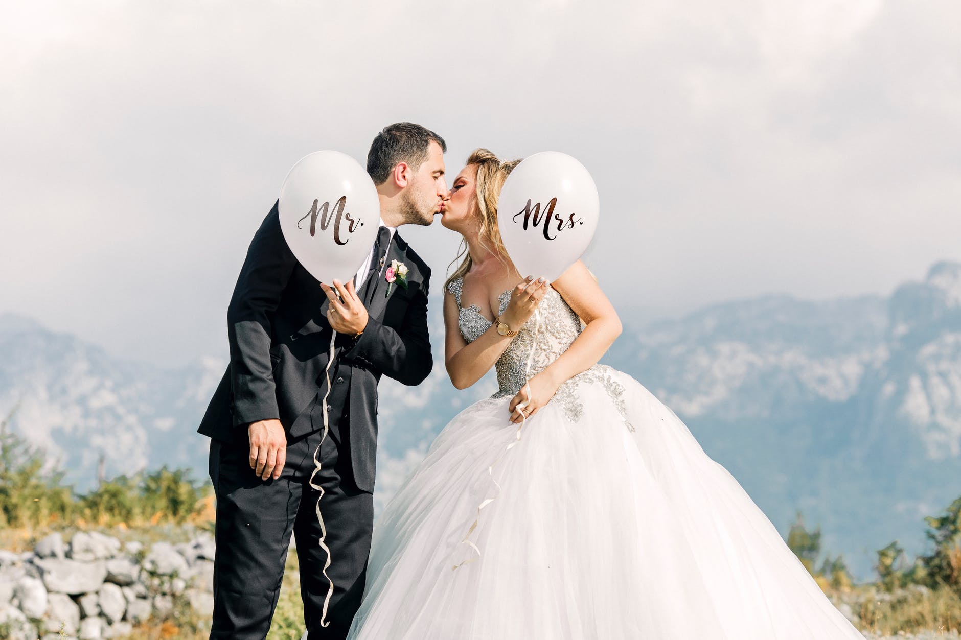 bride and groom with balloons