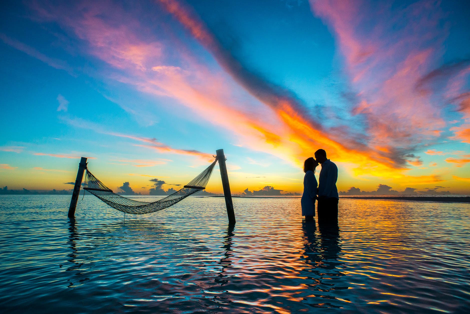 couple in shadow in ocean