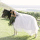 bride laying on horse