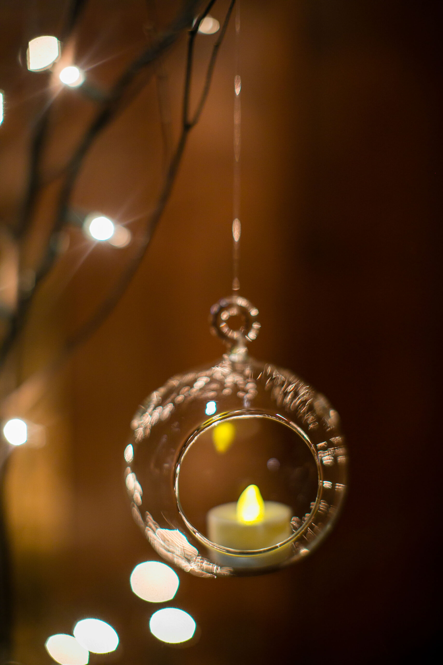 candle in glass hanging ball