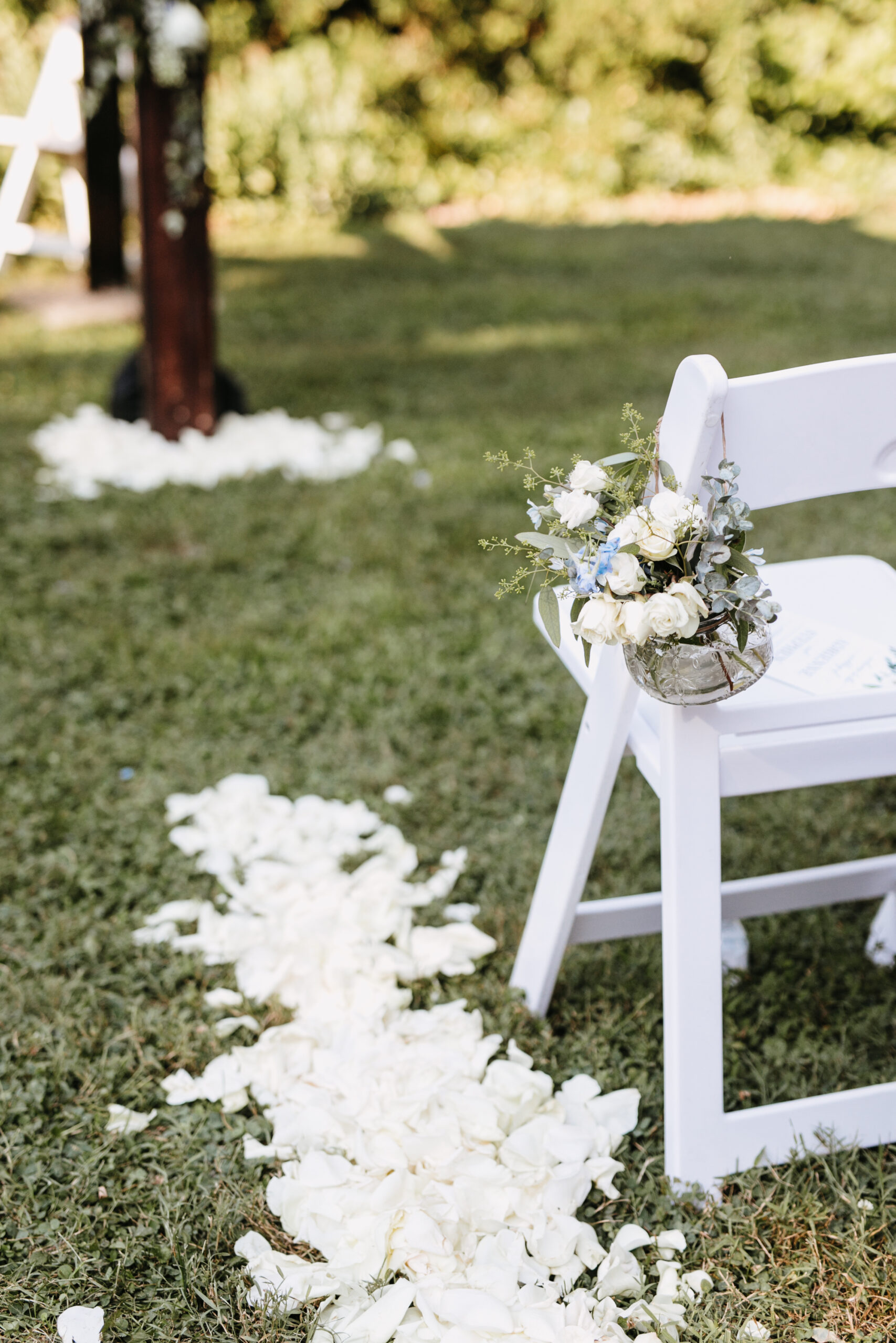 wedding ceremony chair with rose petals