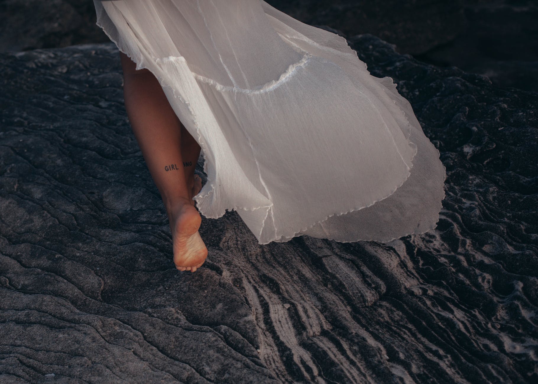 bride running with bare feet