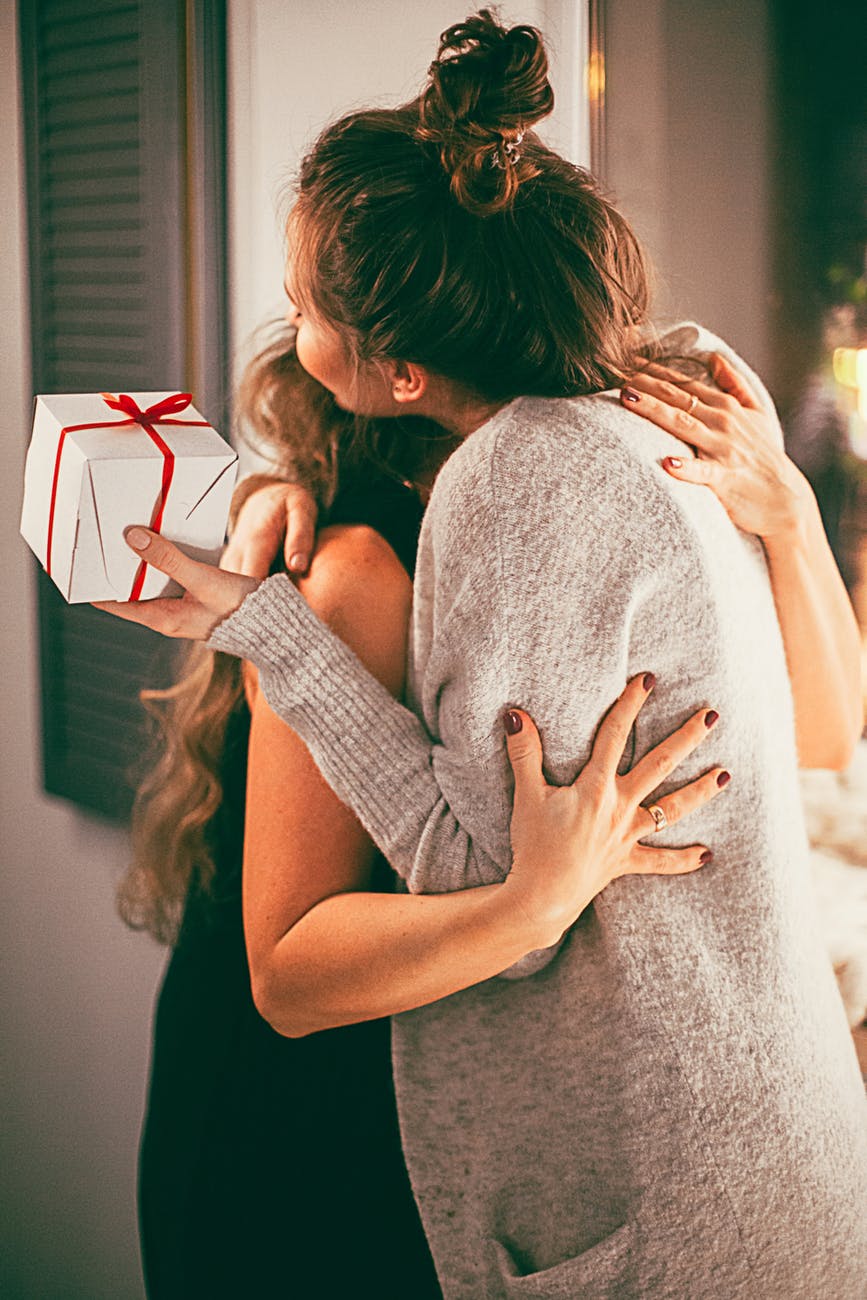 mom and daughter hugging