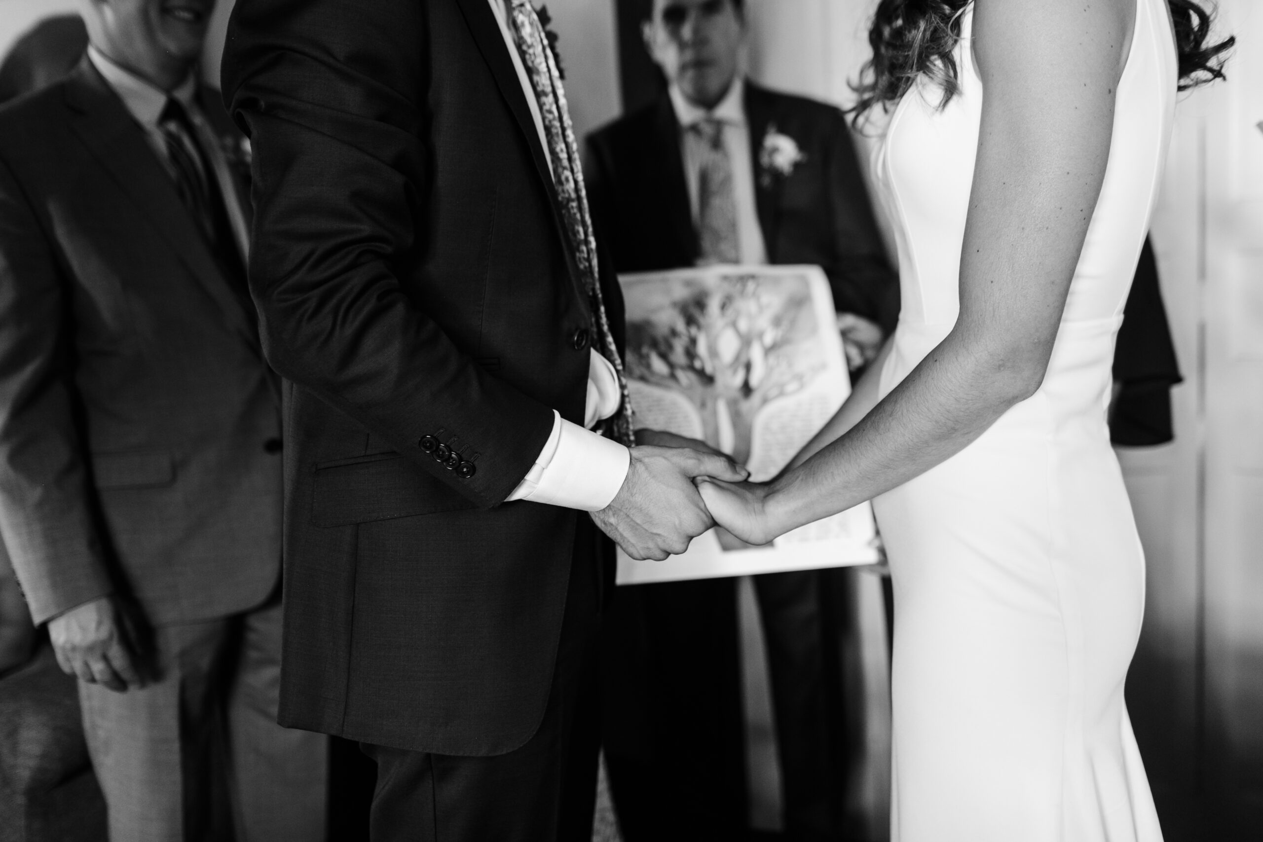 bride and groom holding hands