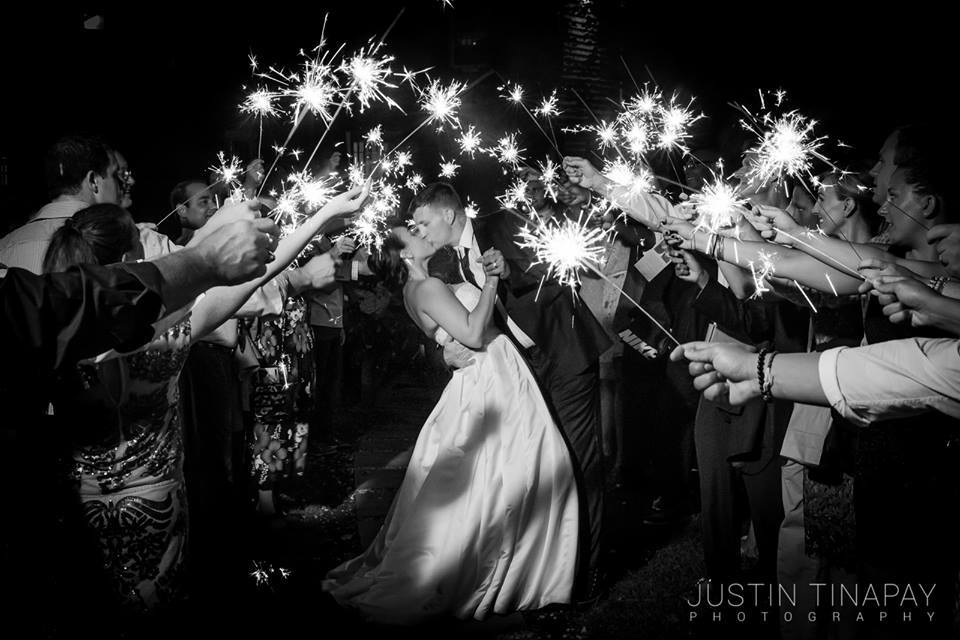 bride and groom inside sparkler exit