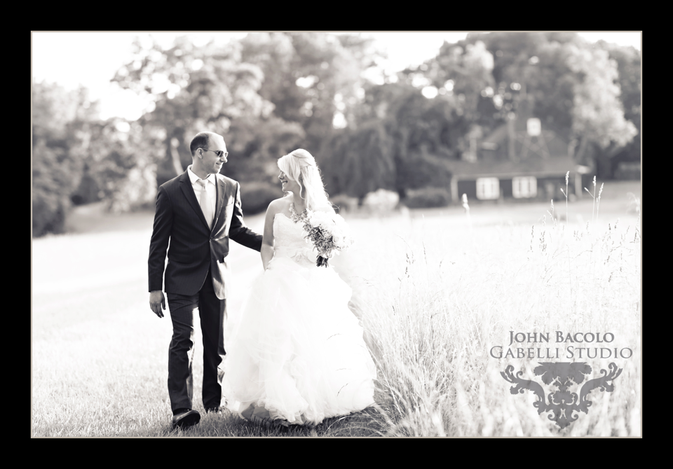 bride and groom hand in hand black and white photo