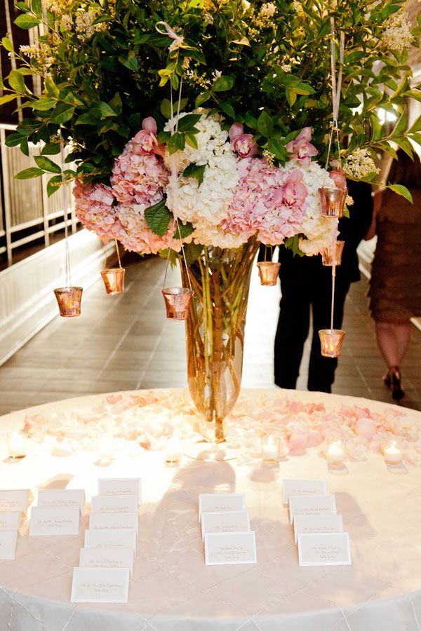 pink and white flowers escort card table