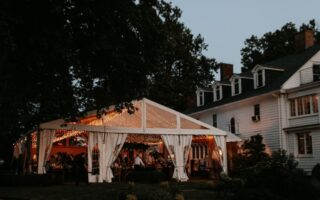outdoor wedding with house and tent