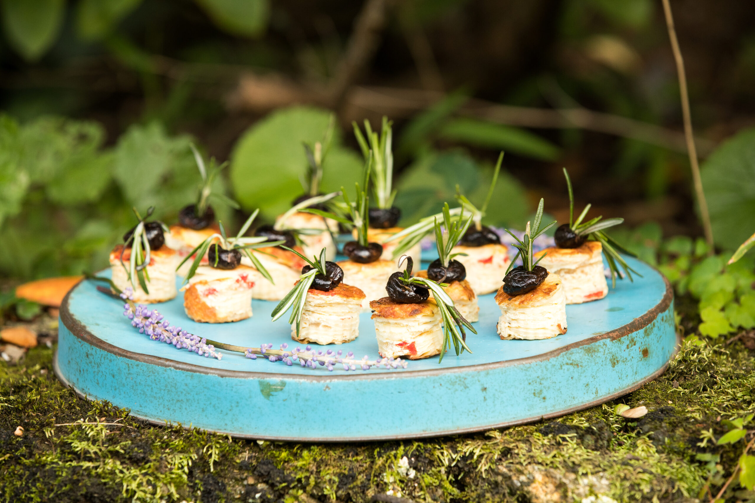 appetizers being passed at a wedding blue tray