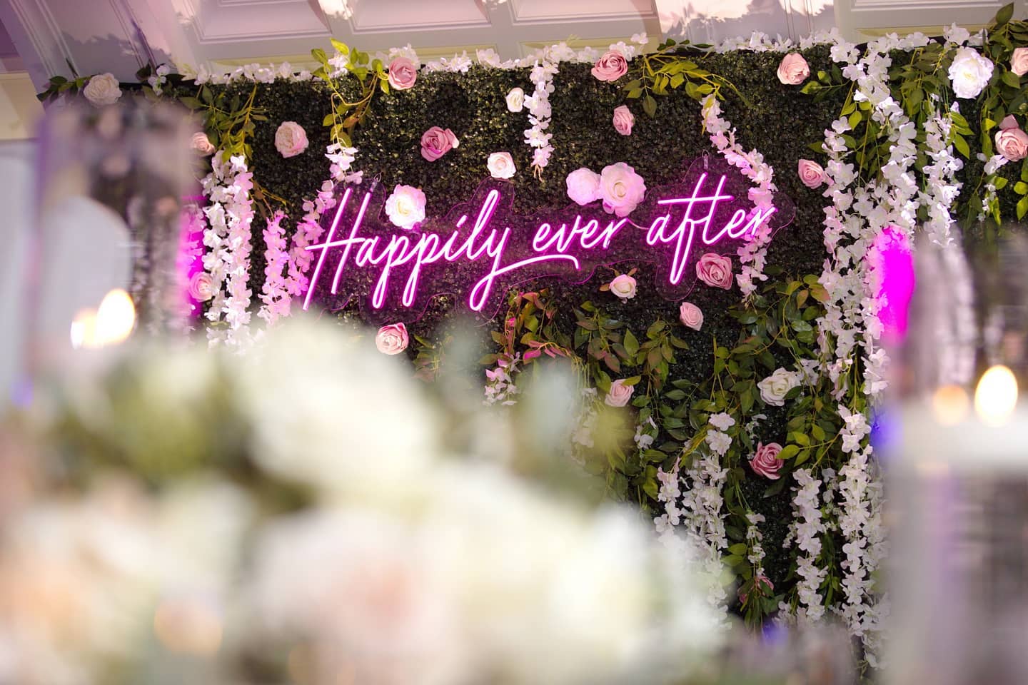neon sign and photo backdrop at wedding