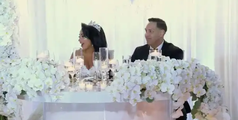 all white sweetheart table with bride and groom