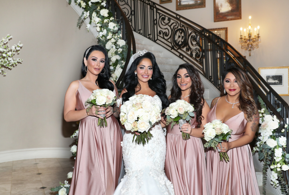 bride with bridesmaids in long blush dresses