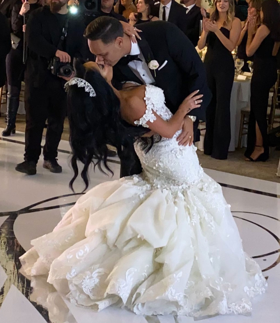 bride and groom kiss on dance floor