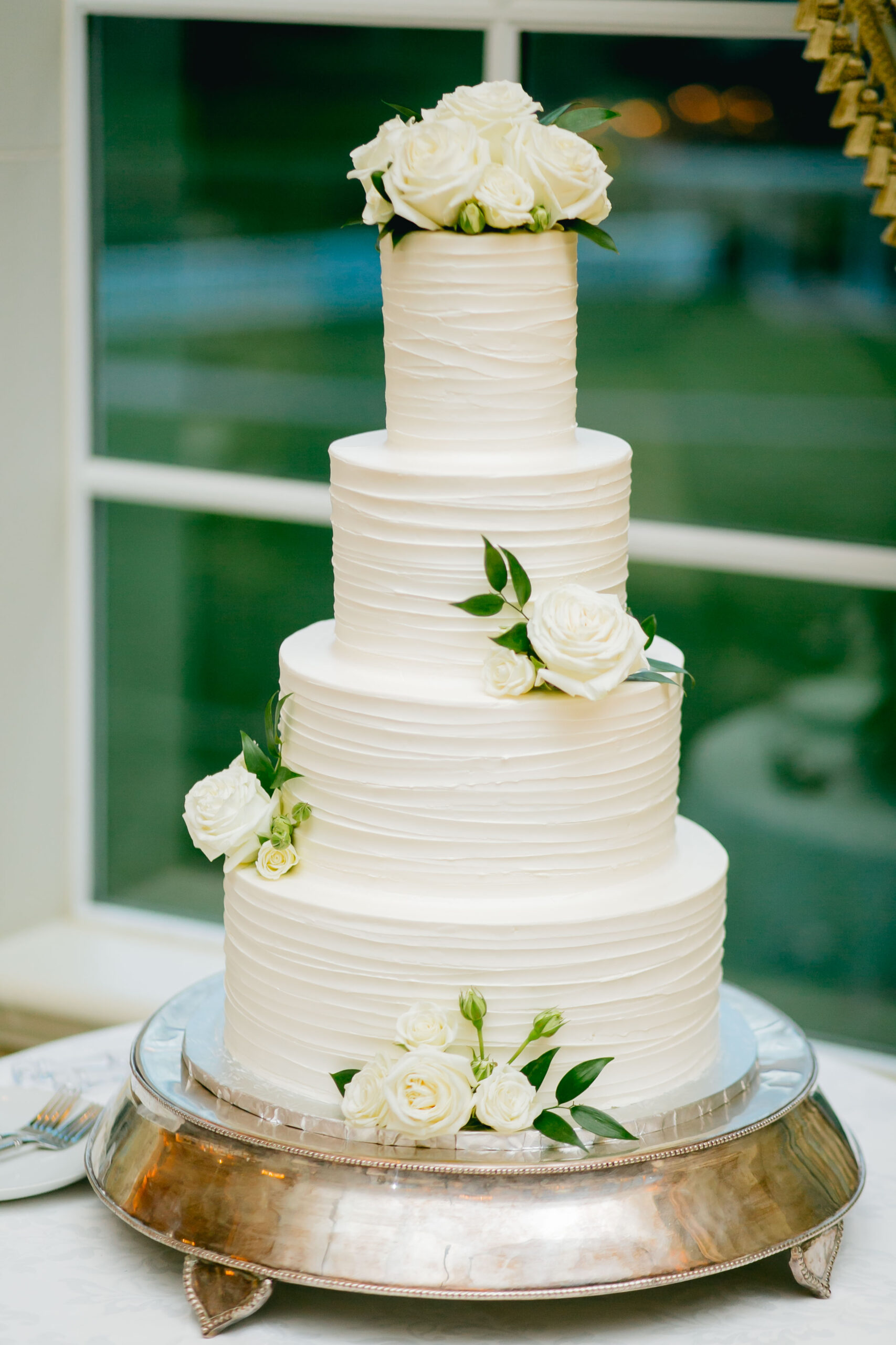 white wedding cake with roses