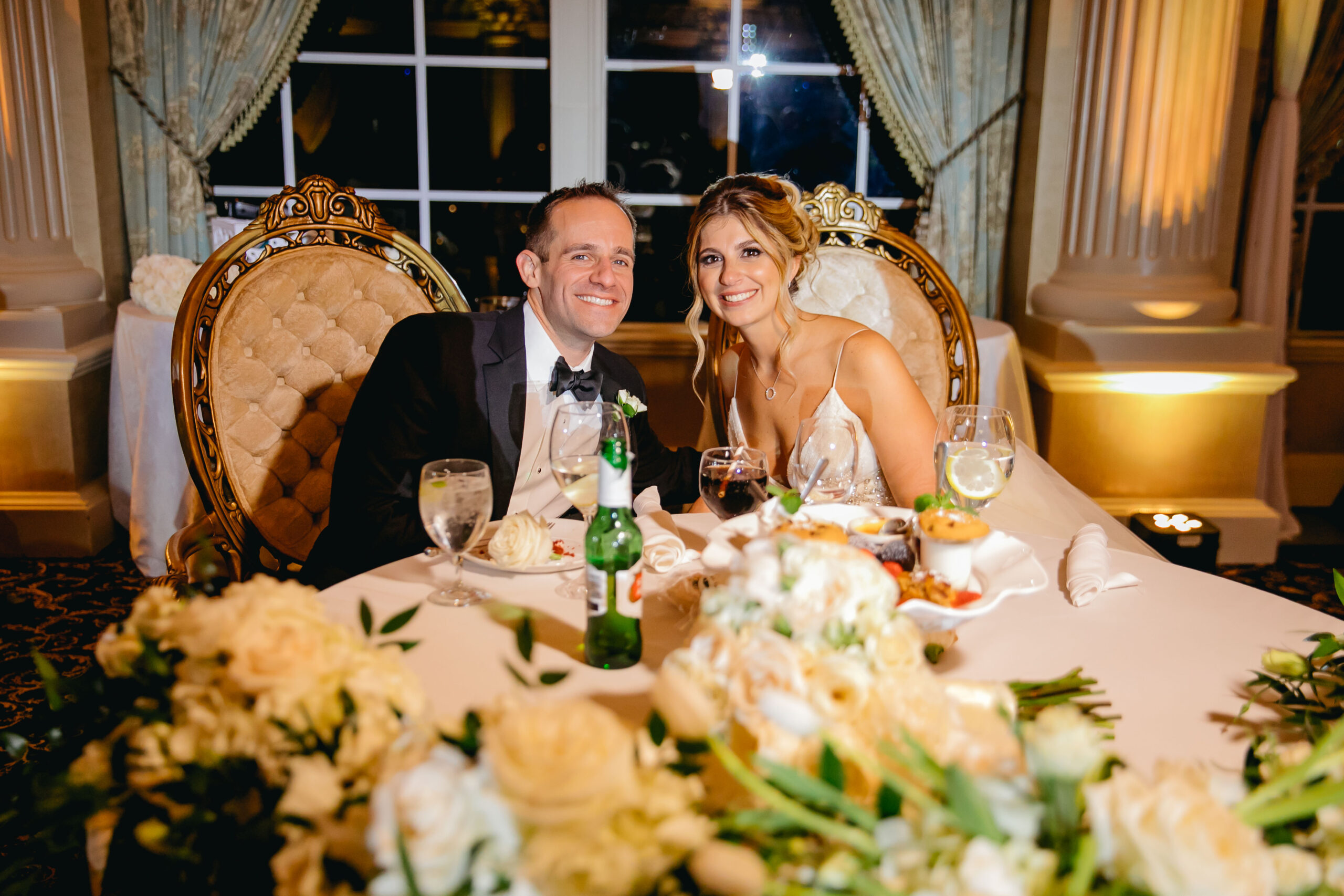 bride and groom at sweetheart table