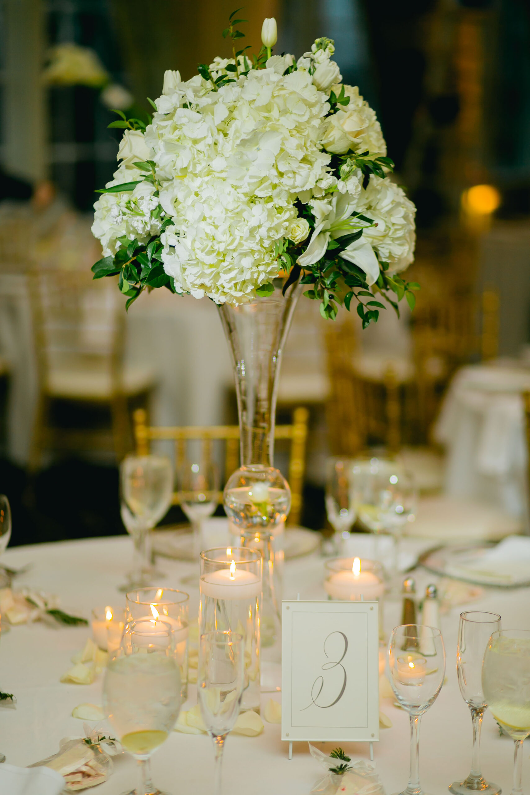 tall white centerpiece at wedding