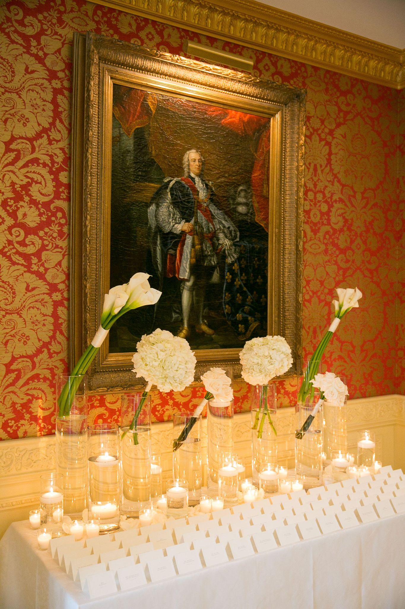 escort card table with flowers and candles