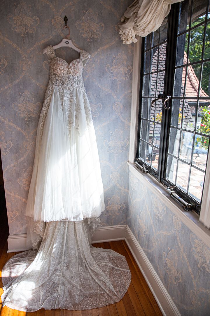 wedding gown hanging on wall