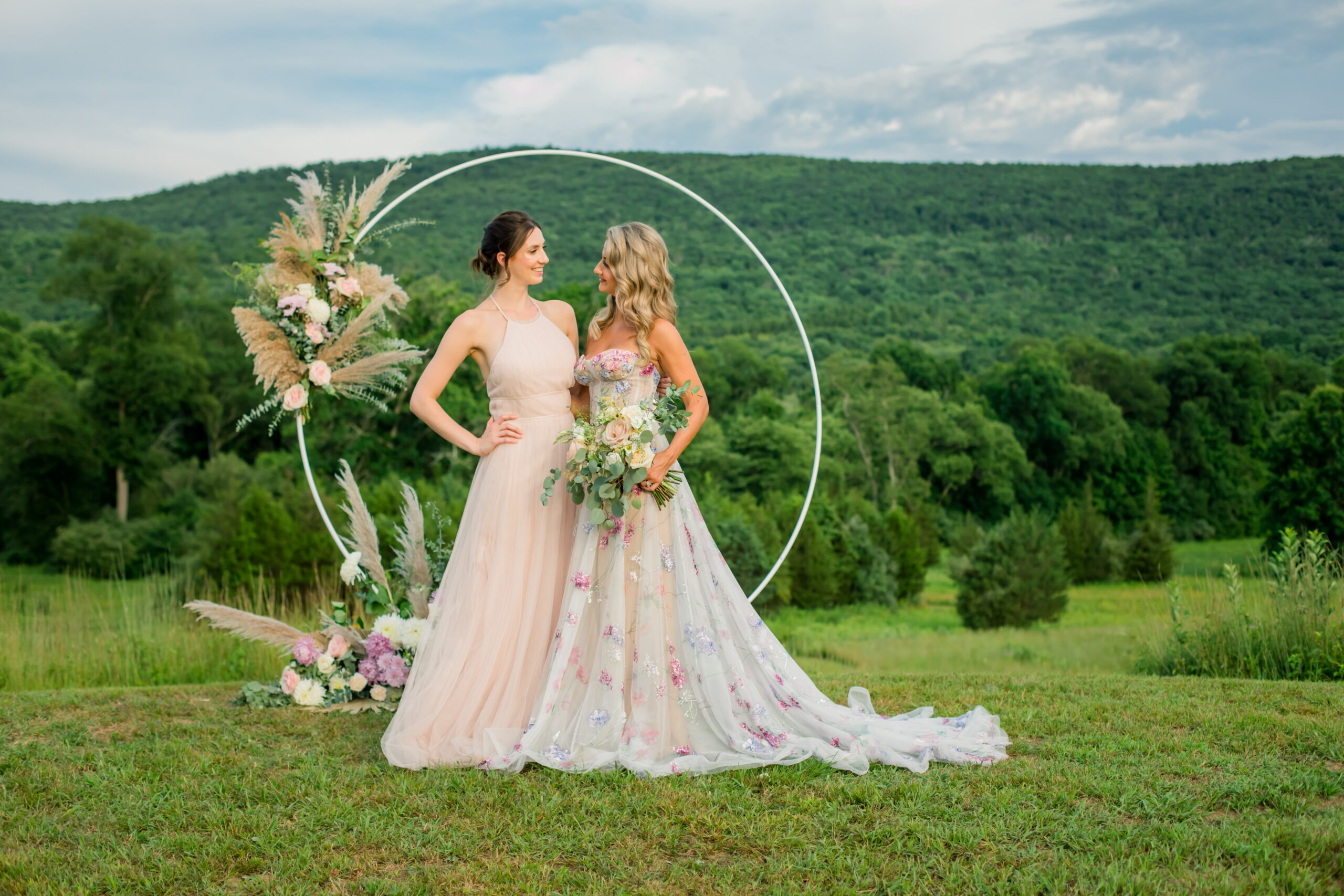 bride and bridesmaid at outdoor boho chic wedding