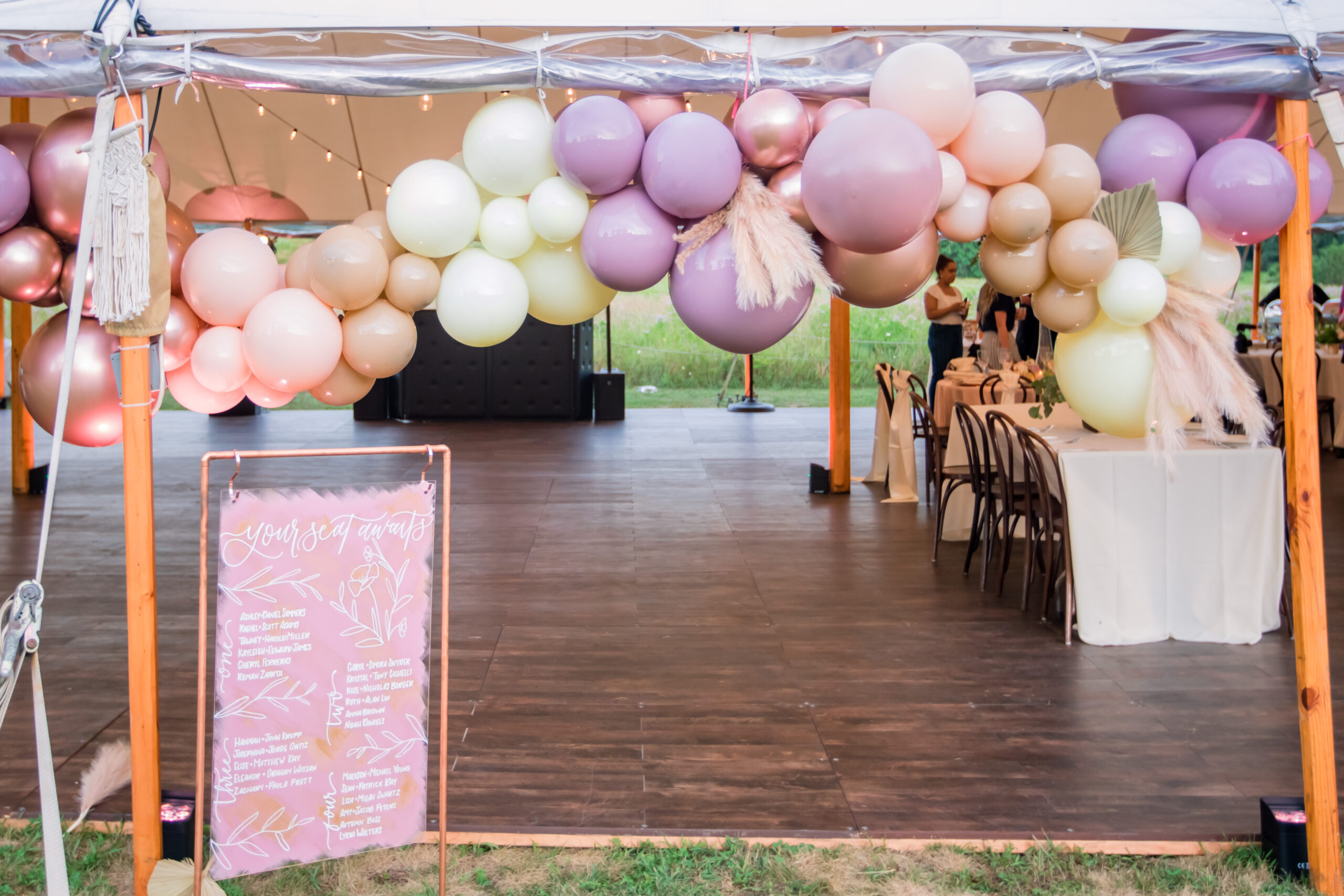 balloon arch outside wedding tent