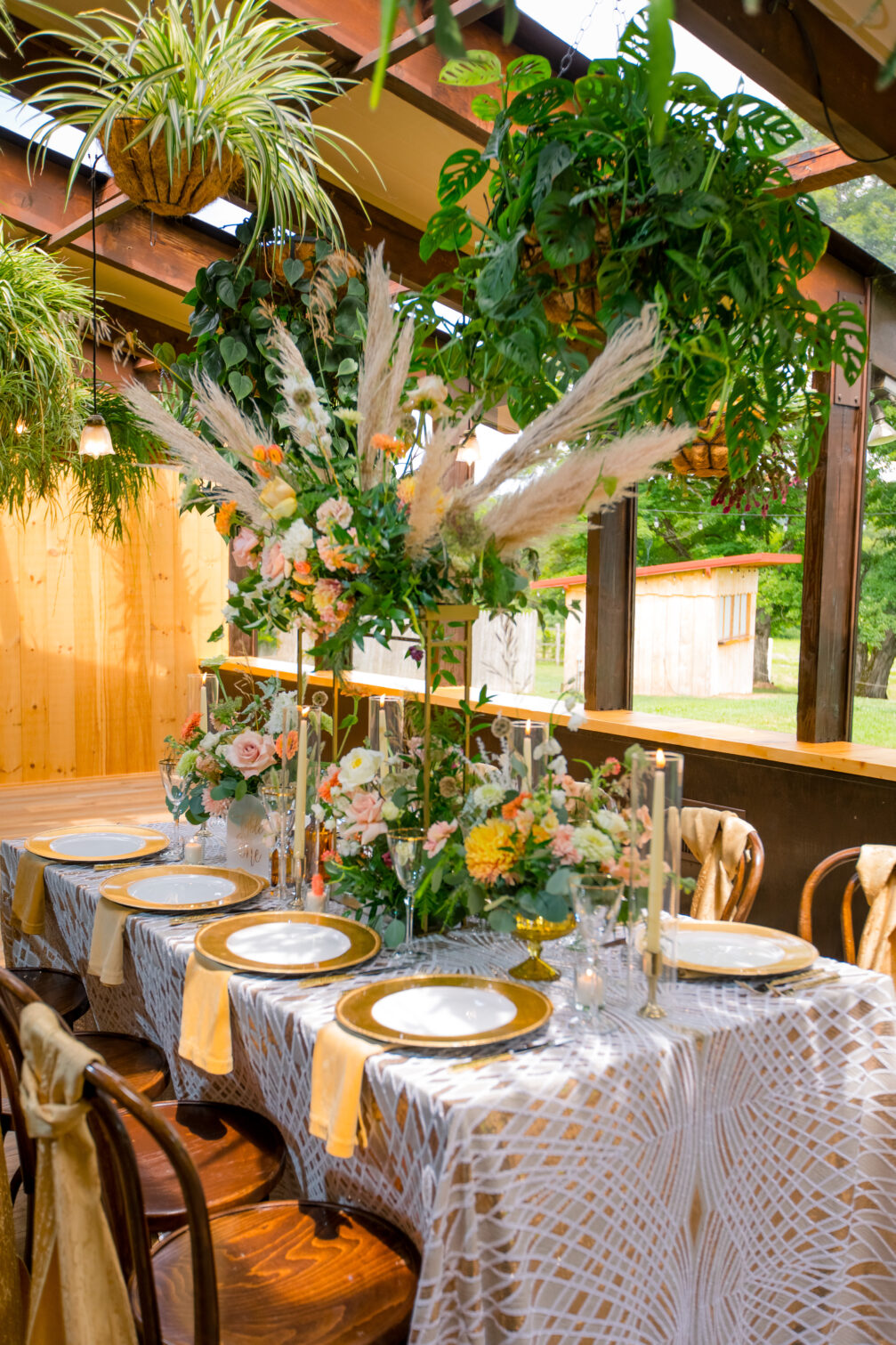 long table at wedding gold and white boho florals