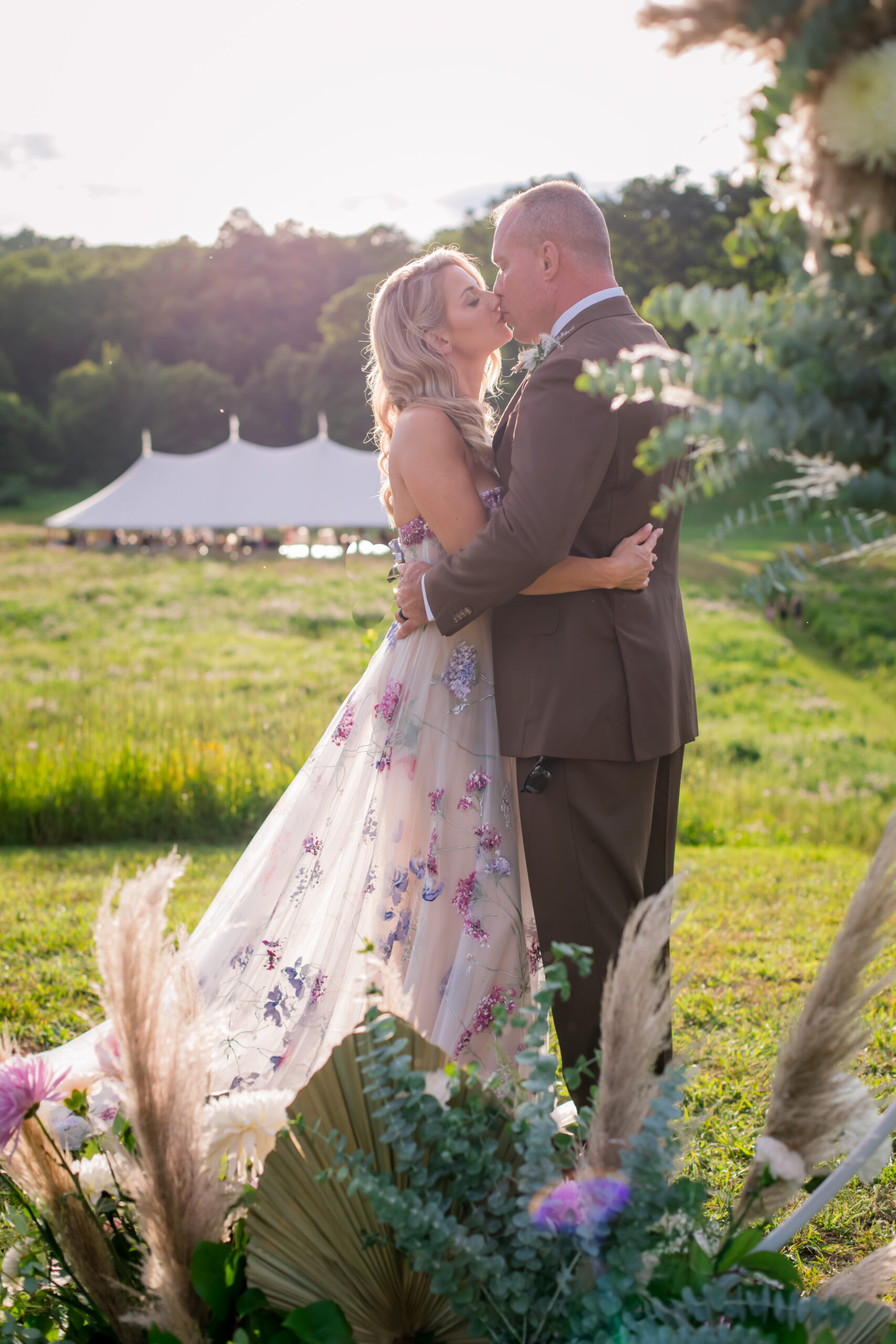 boho chic bride and groom kissing