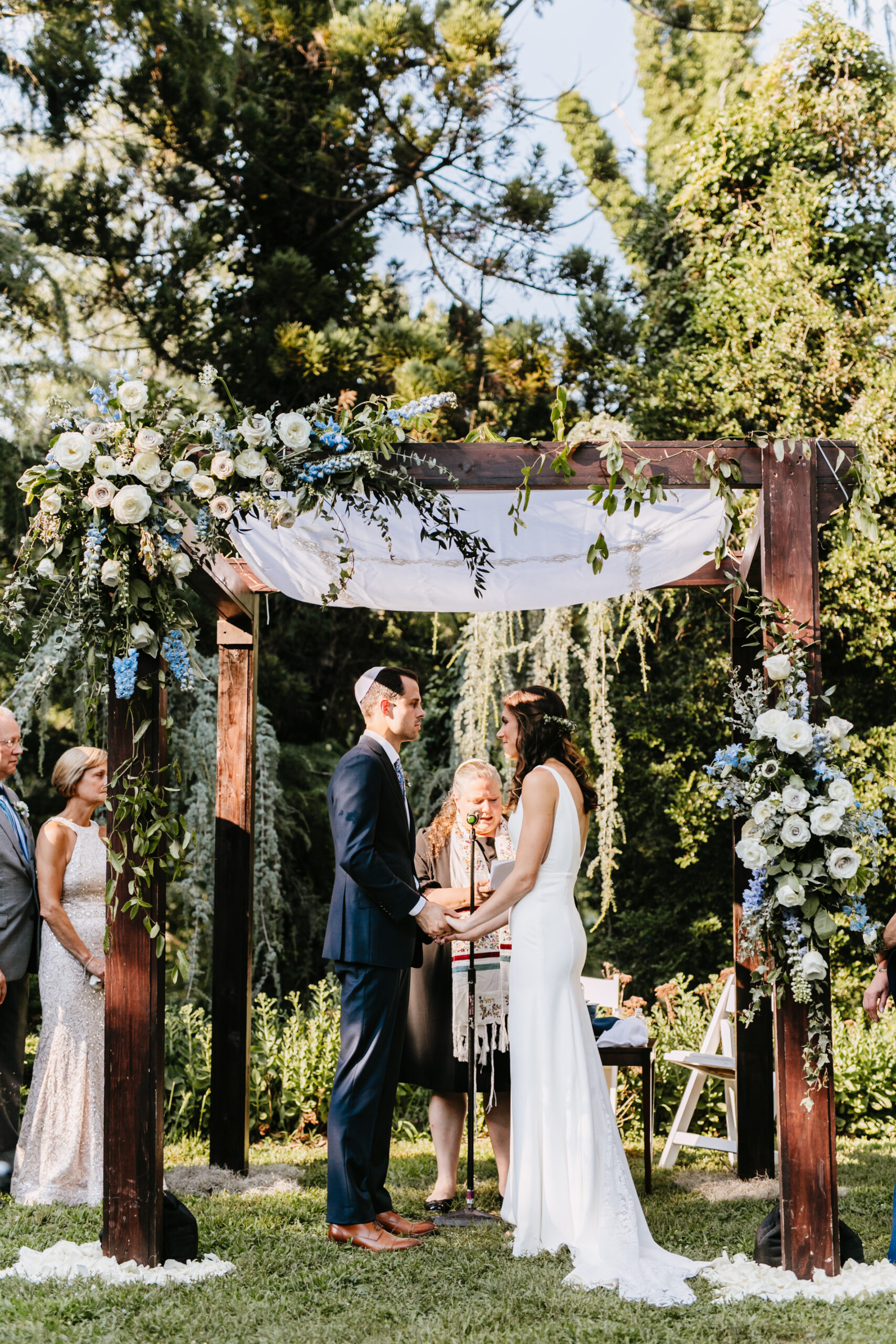 bride and groom under chuppah