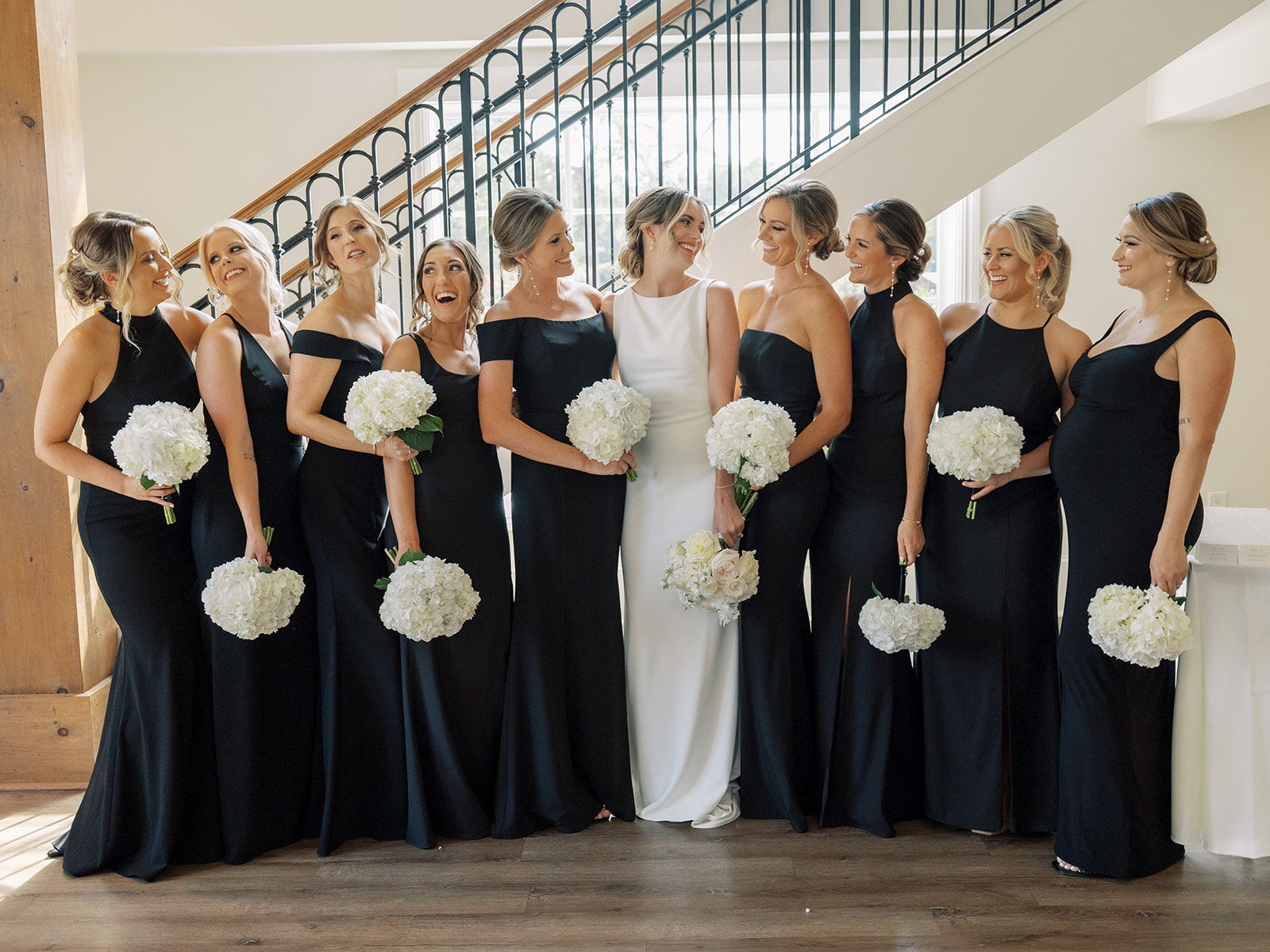 bride with bridesmaids in black dresses