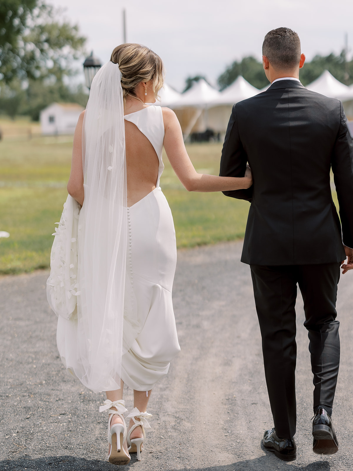 bride and groom walking outside
