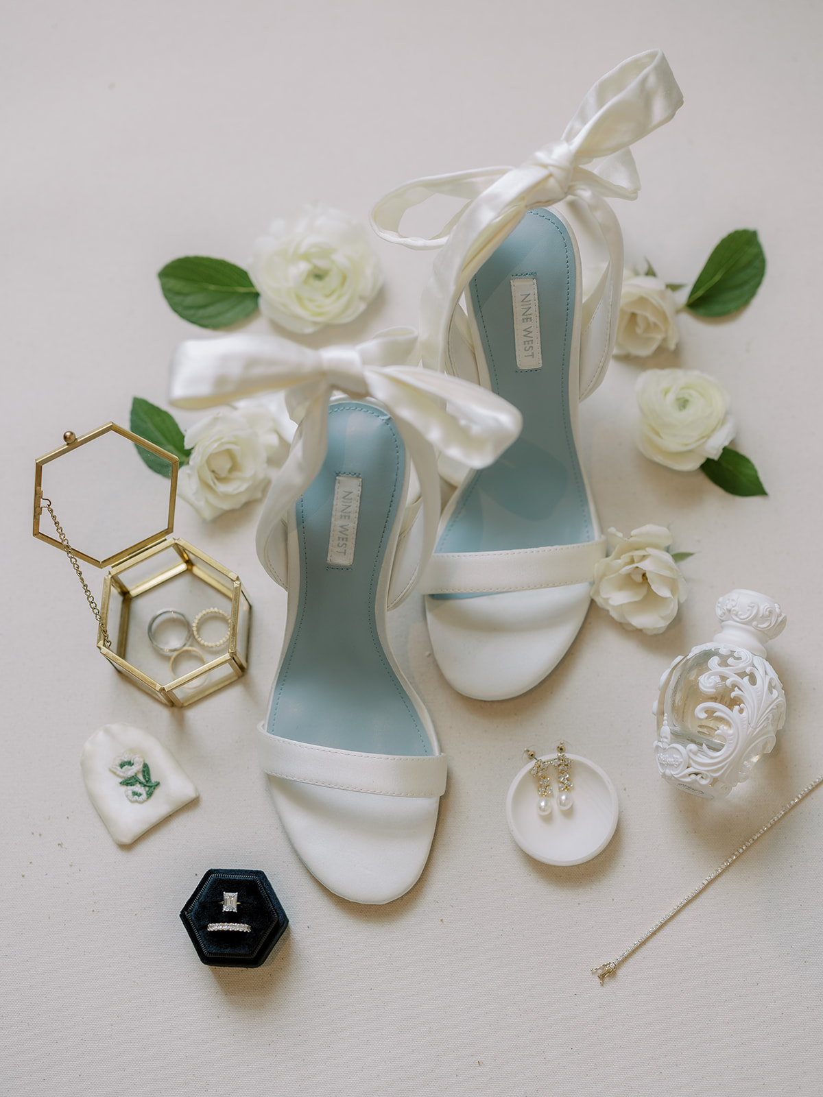 bridal shoes and rings and flowers detail photo