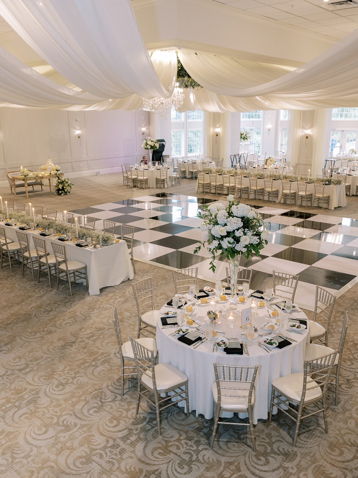 black and white checkered dance floor at wedding venue