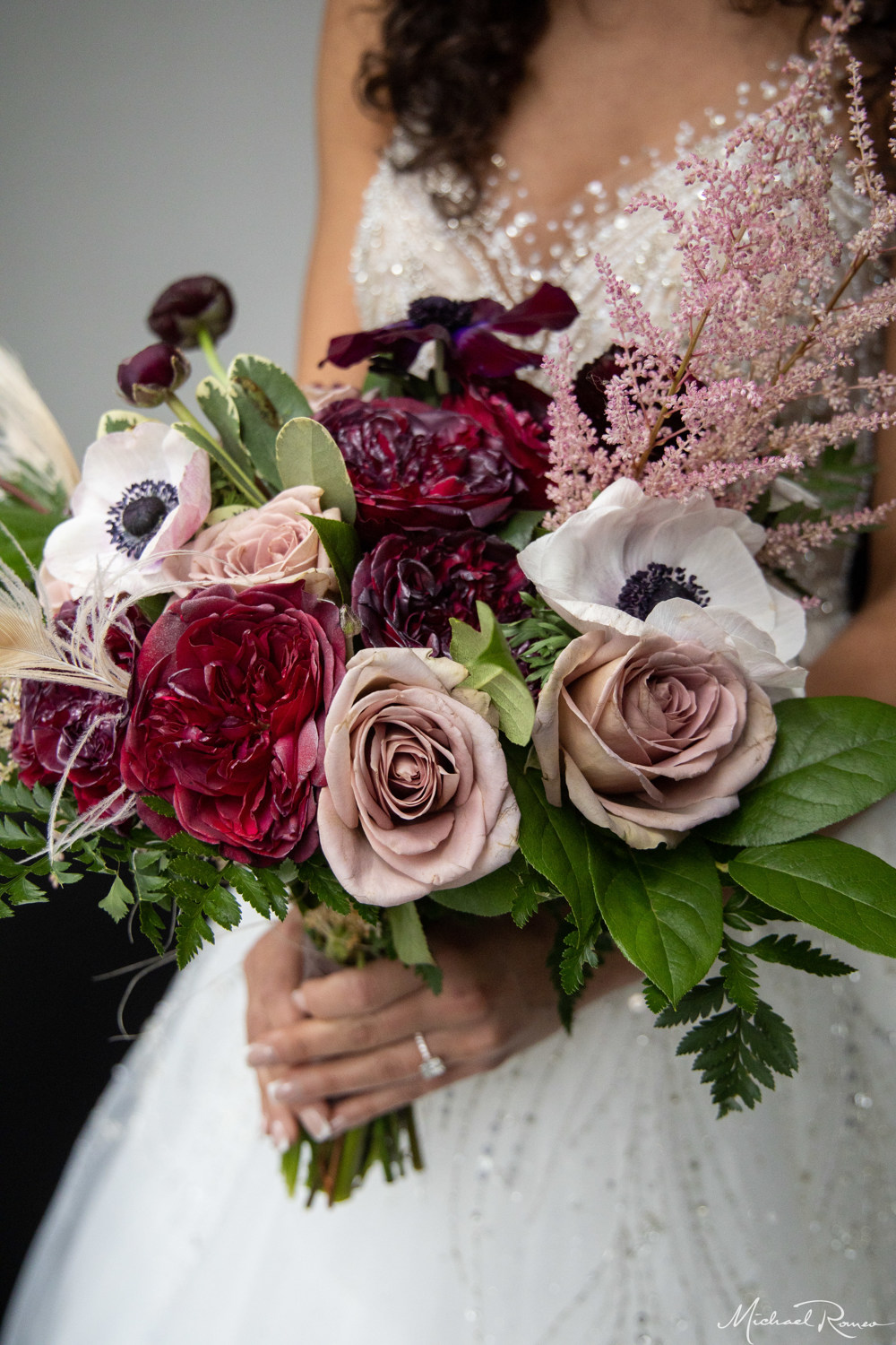 winter bridal bouquet with reds, plums, and pink