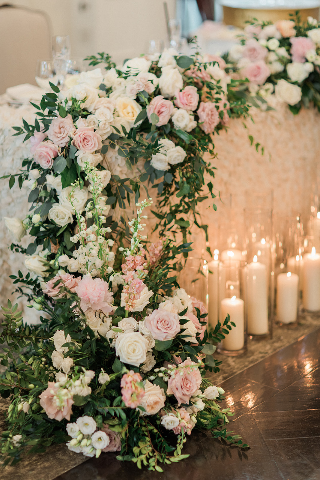 white pink and cream roses with greenery for wedding decor