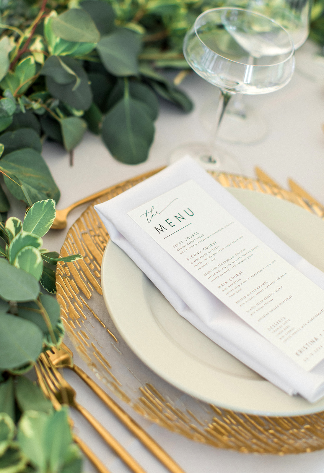 wedding menu on gold charger plate