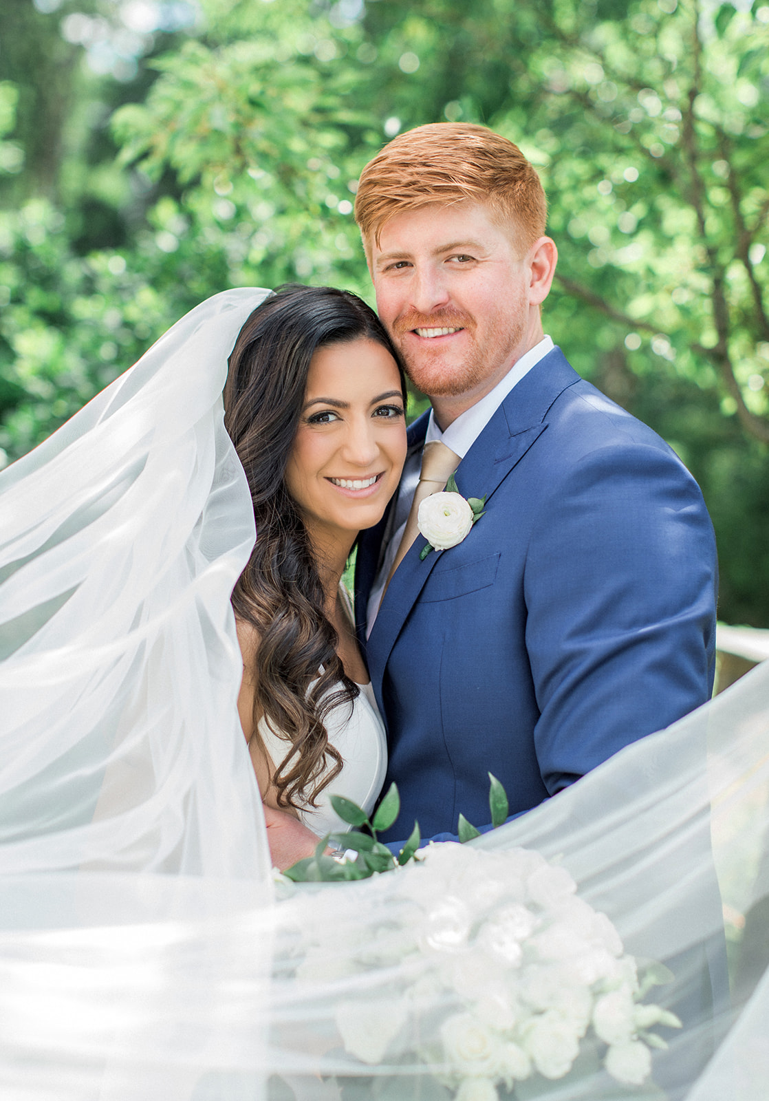 bride and groom smiling together