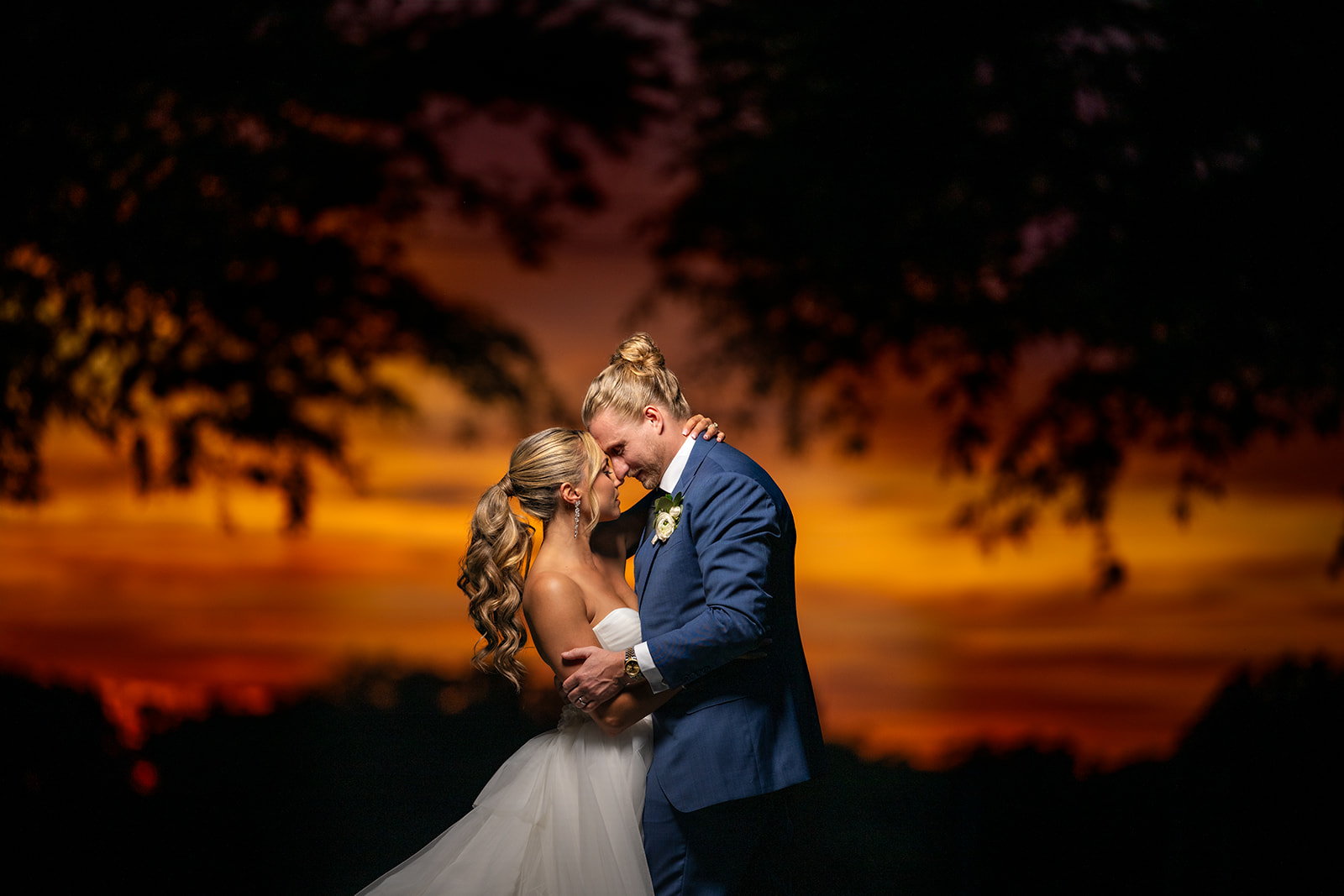 golden hour sunset photo of bride and groom