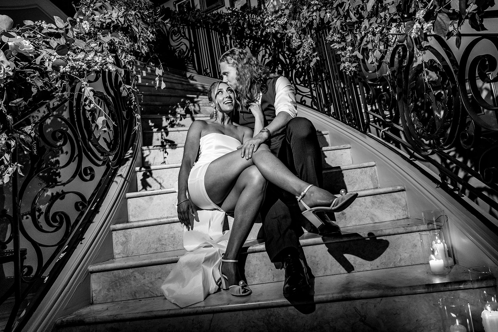 bride and groom in black and white on stairs