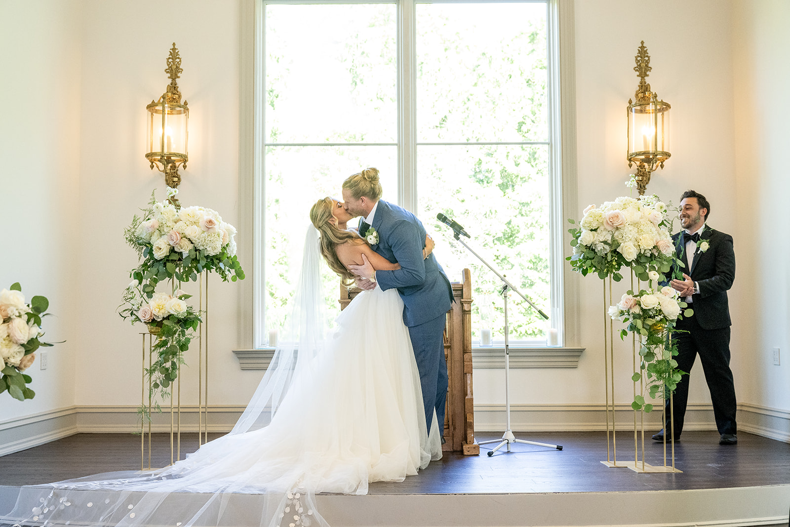 bride and groom kissing during wedding ceremony