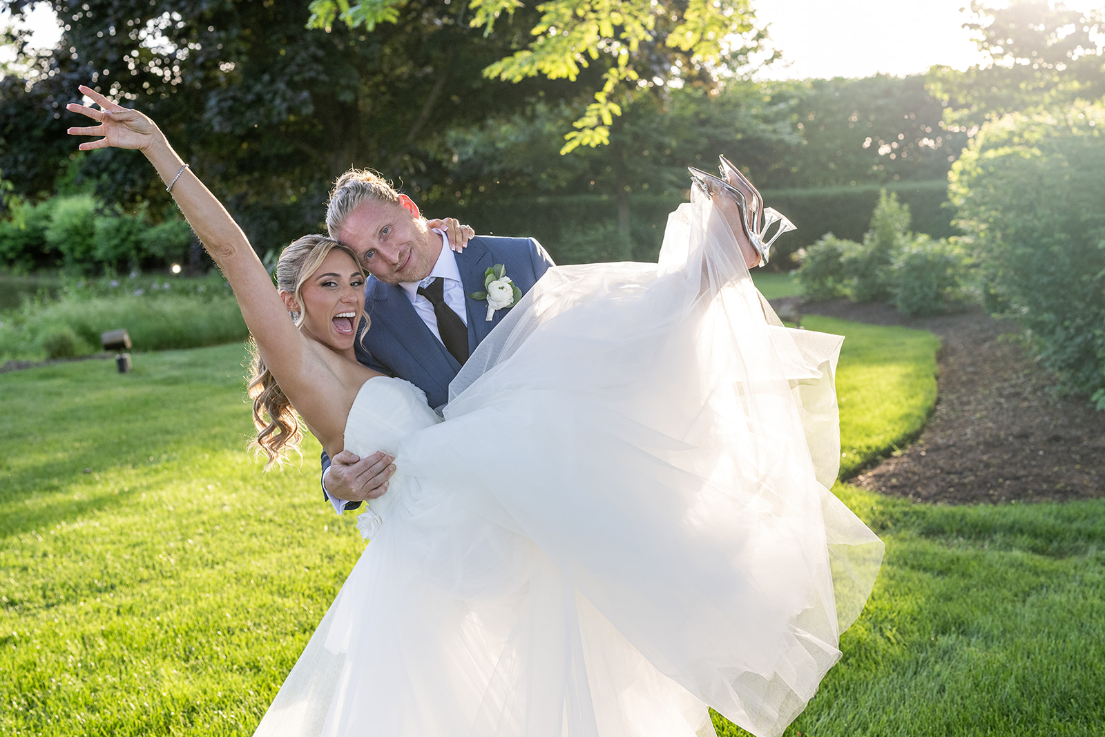 bride being lifted up by groom