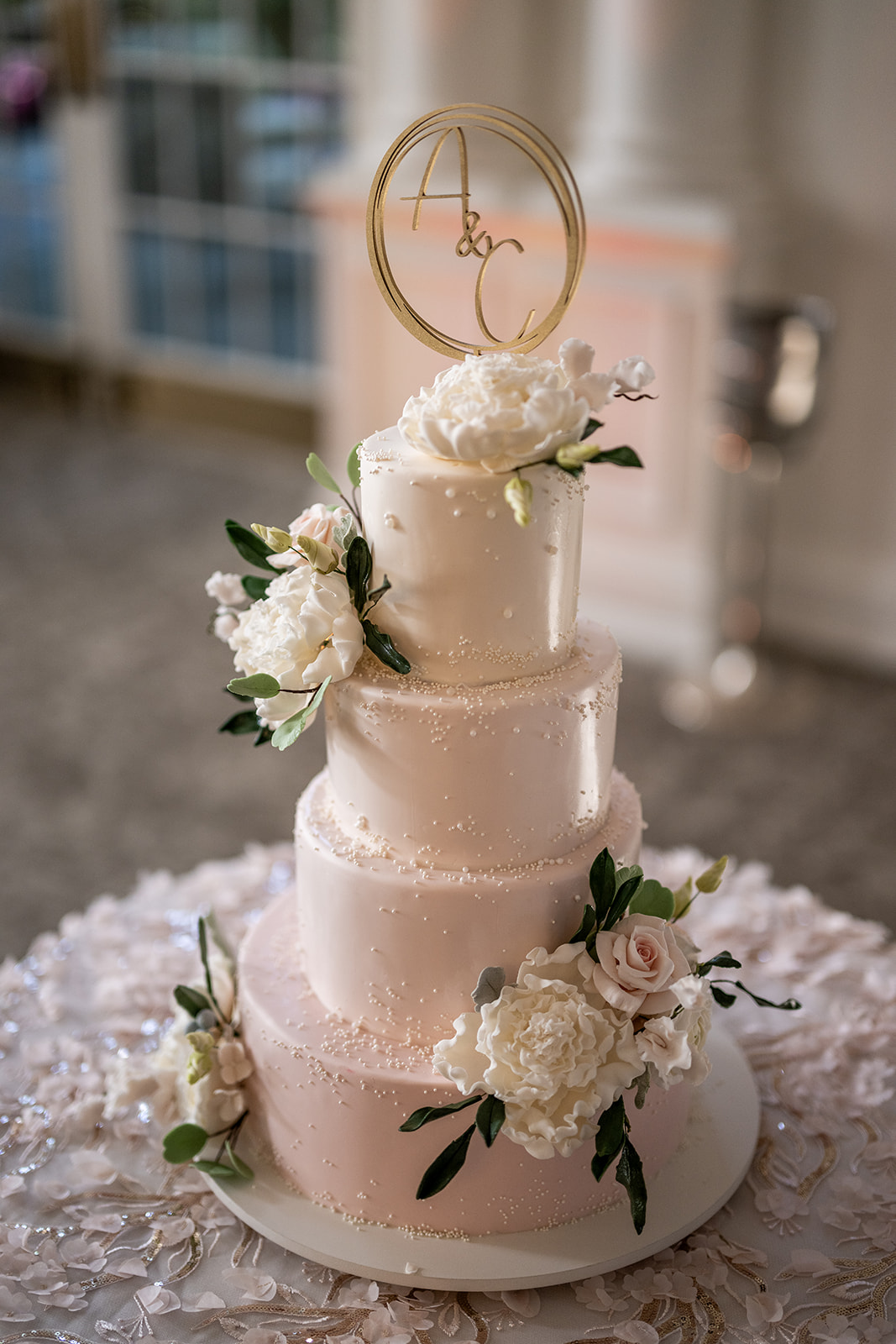 soft blush wedding cake with florals