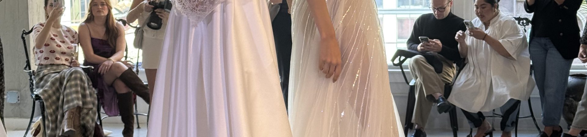 two models wearing high end wedding gowns