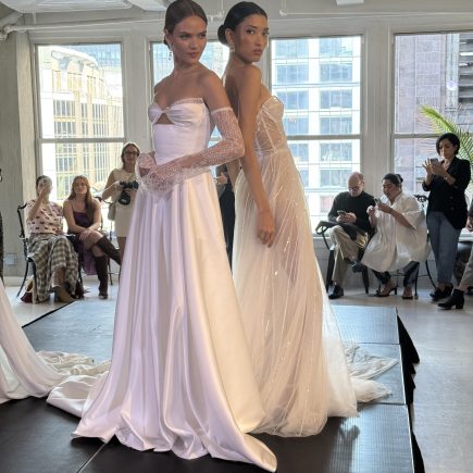 two models wearing high end wedding gowns