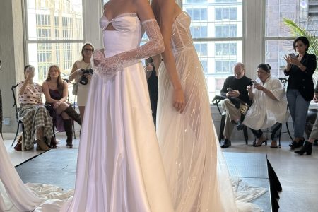 two models wearing high end wedding gowns