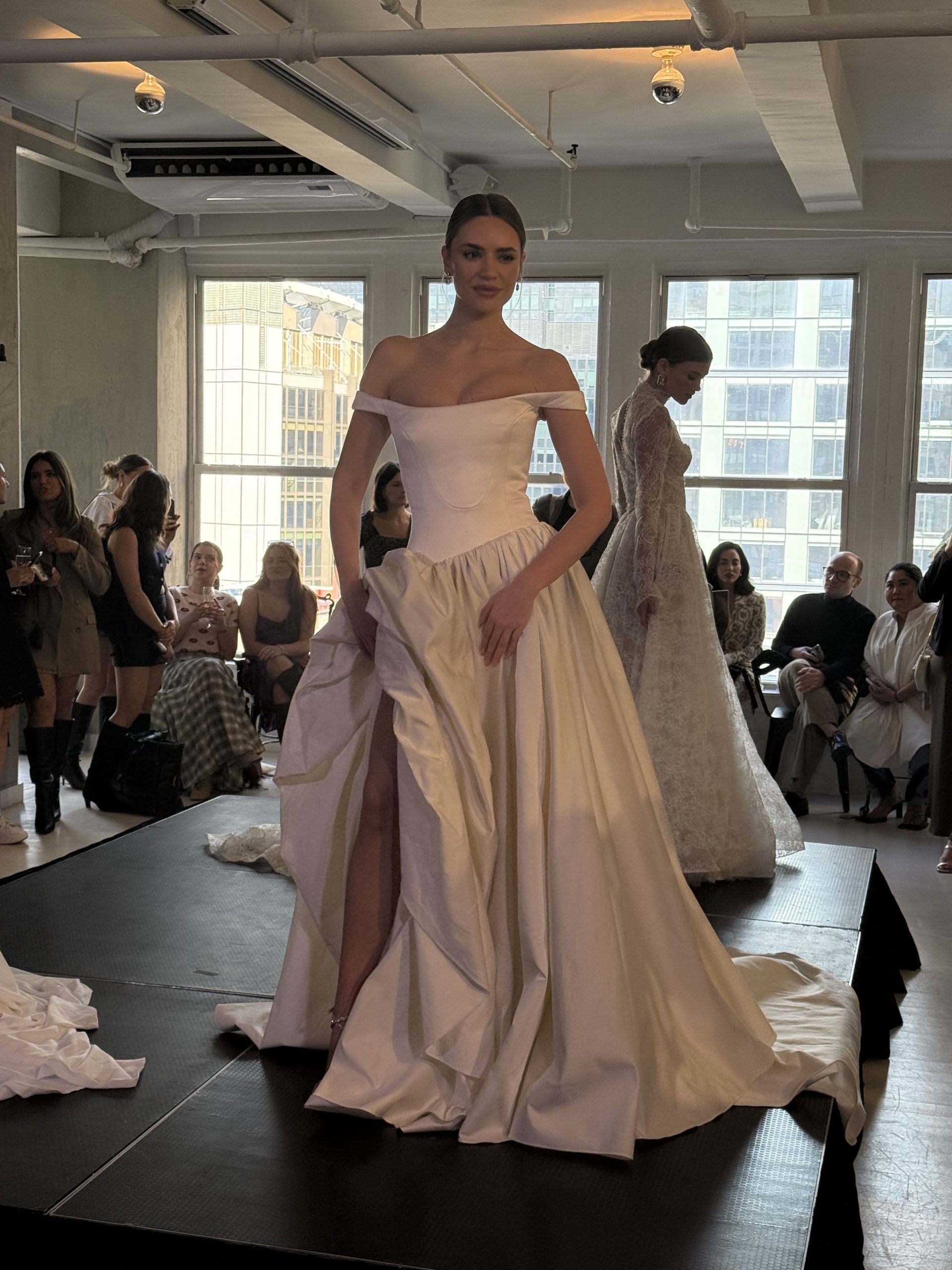 model wearing off the shoulder wedding gown