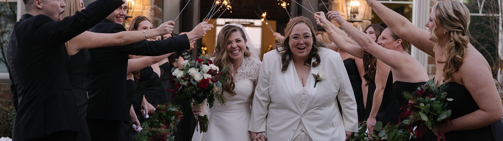 lesbian couple coming out of the chapel after getting married at Park Savoy with sparklers