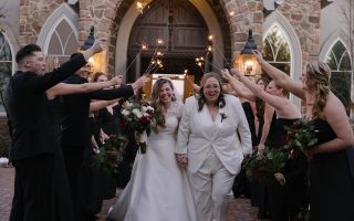 lesbian couple coming out of the chapel after getting married at Park Savoy with sparklers