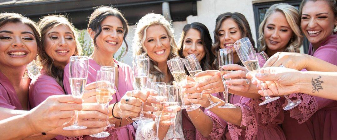 bride and bridesmaids with champagne