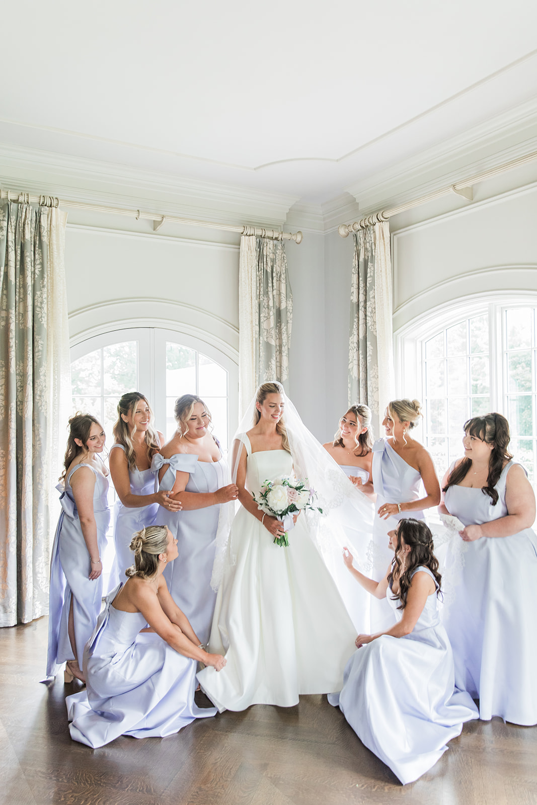 bride with bridesmaids in blue dresses