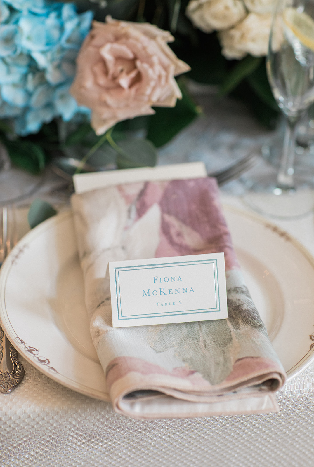 floral napkin with placecard at wedding