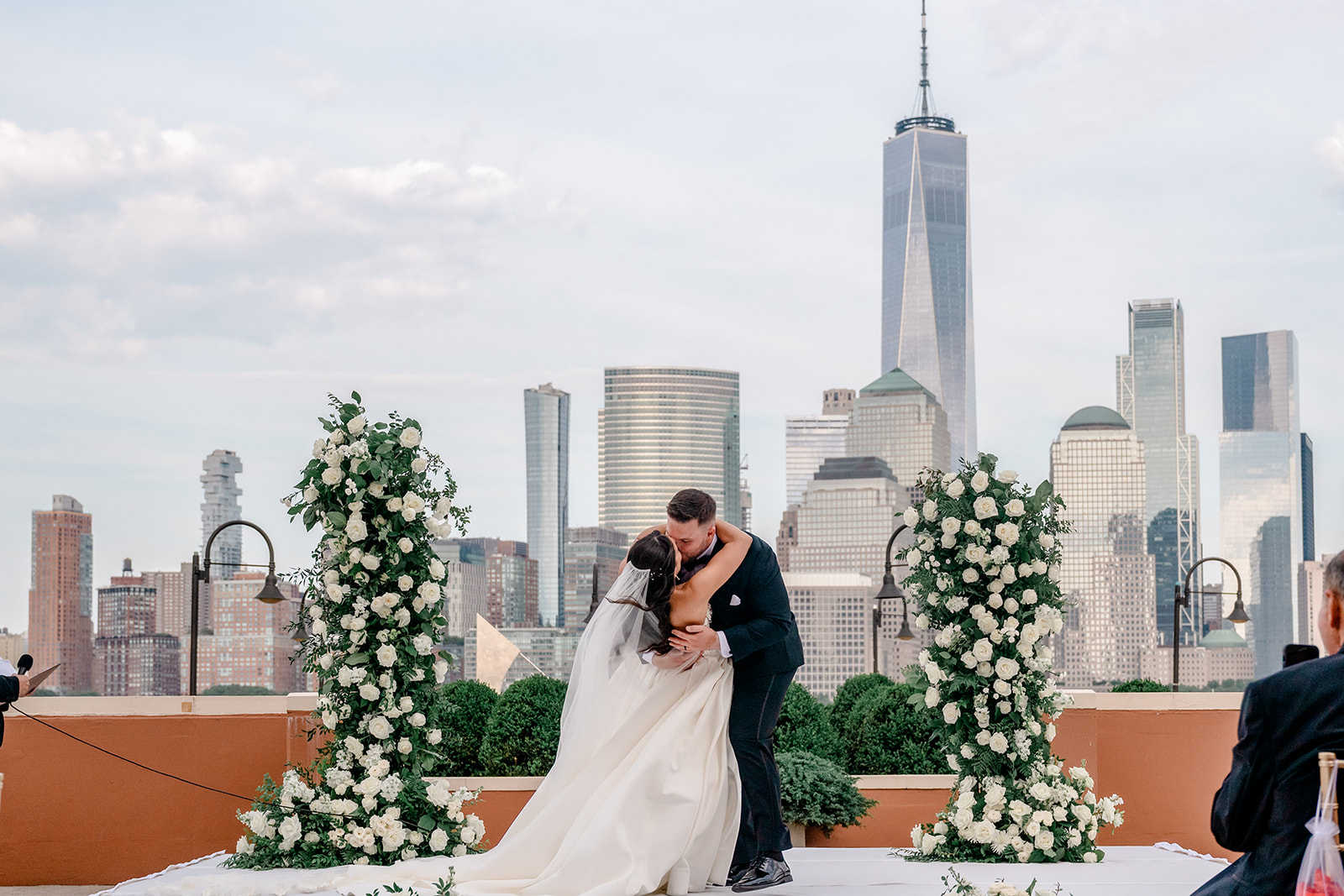 bride and groom kiss during ceremony